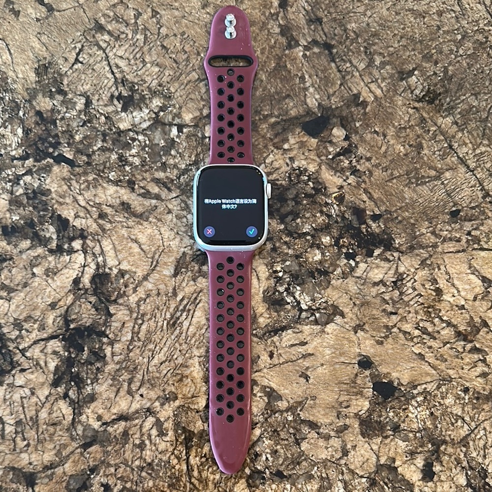 Apple Watch Series 7 with GPS & Cellular. 45mm with Burgundy Sport Strap.